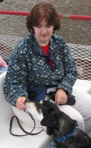 Dog getting treats on a boat