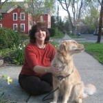 Woman with Golden Retriever sitting on the ground