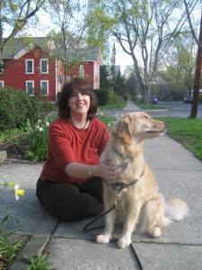 Woman with Golden Retriever sitting on the ground