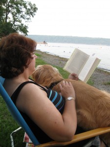 Golden Retriever lying on a woman's lap.