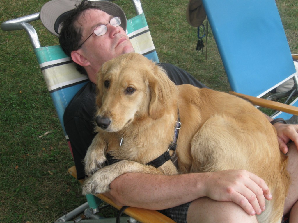 Mike and Honey napping Man sleeping in chair with Golden Retriever on his lap