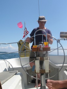 Mike at the wheel of the sailboat on Lake Ontario.