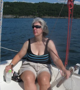 woman at sailboat tiller