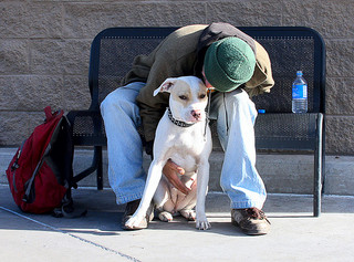 A homeless man and his dog.