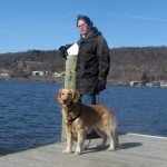 Honey the Golden Retriever poses on Cayuga Lake in Ithaca, NY.