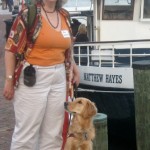 Honey the Golden Retrievers poses with Pamela in Alexandria, VA.