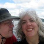 Pamela & Michael smile while sailing on Cayuga Lake.