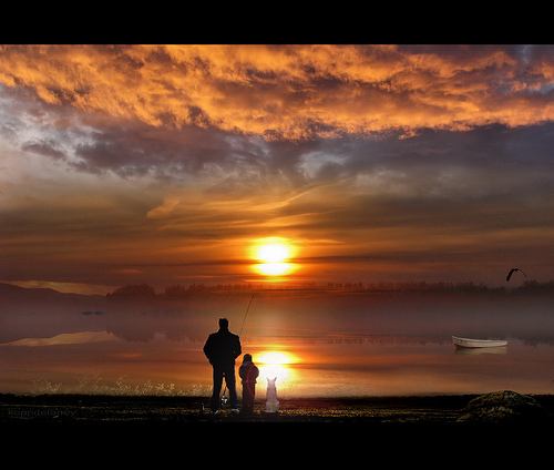 Fisherman with friends at sunset.