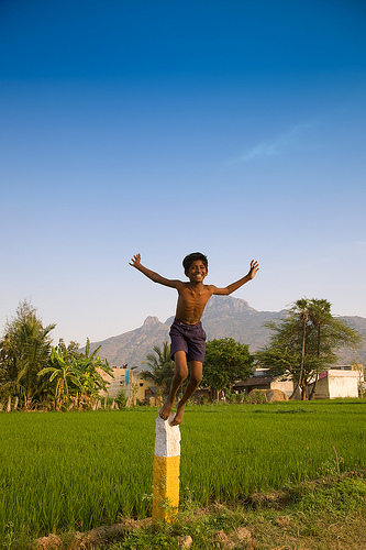 Happy boy jumps in India.