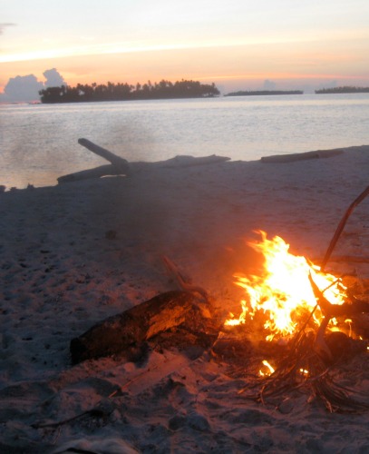Burning garbage on the beach.