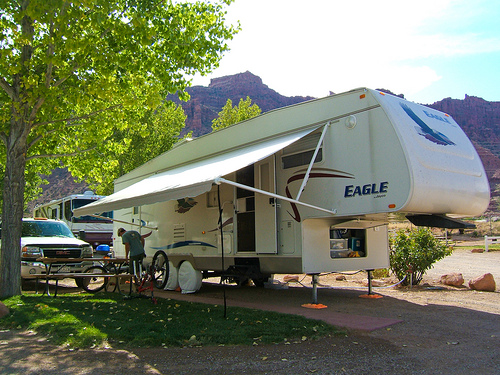 An RV set up at a camp site.