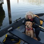 Honey the golden retriever and Pam in dinghy.