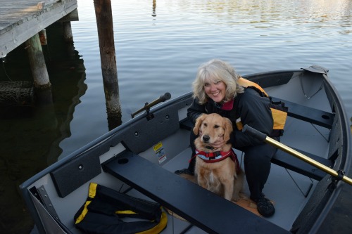 Honey the golden retriever and Pam in dinghy.