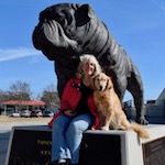 Honey the golden retriever and Pam with the Citadel bulldog.
