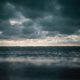 Avoid Dog Disasters in Rough Seas (dark storm clouds over body of water)
